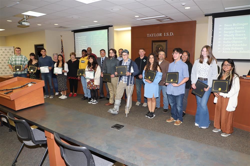  Students holding certificates