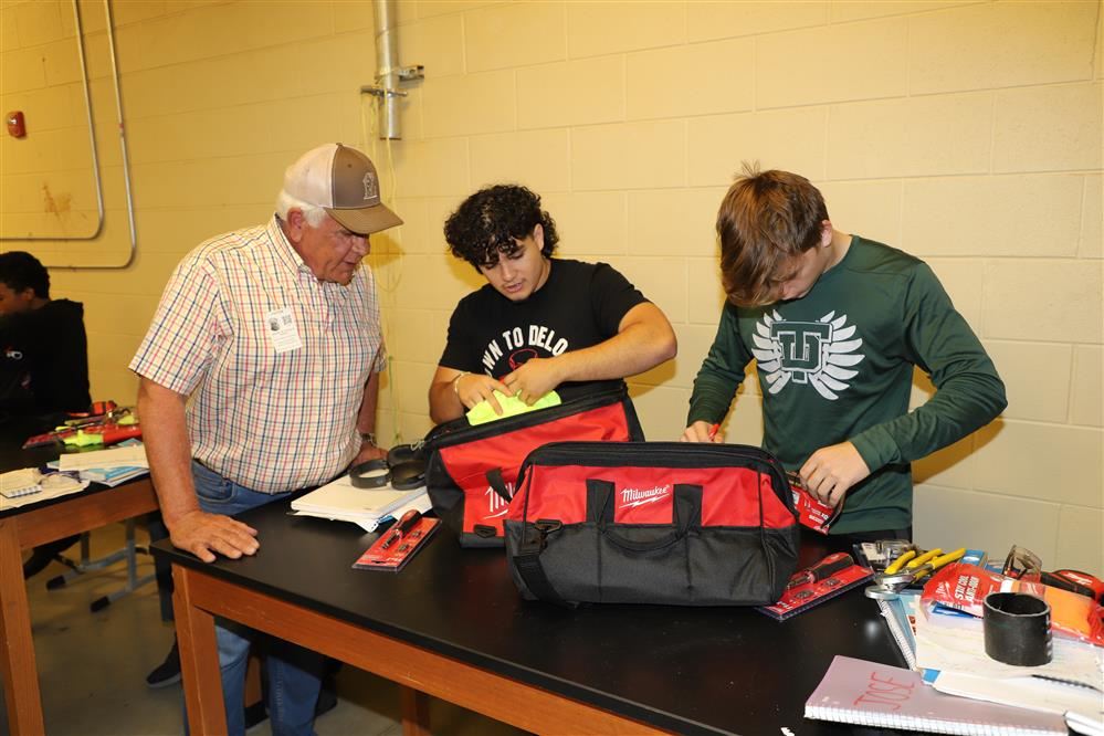  Students with tool bags.